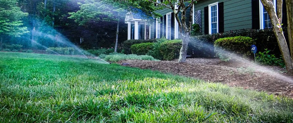 Sprinkler heads on green grass in Cary, NC.