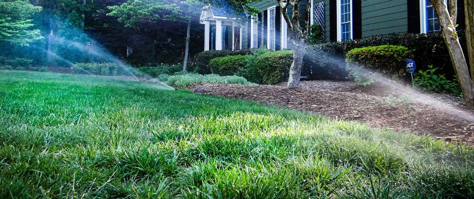 Sprinkler irrigation watering a lawn in Cary, NC.
