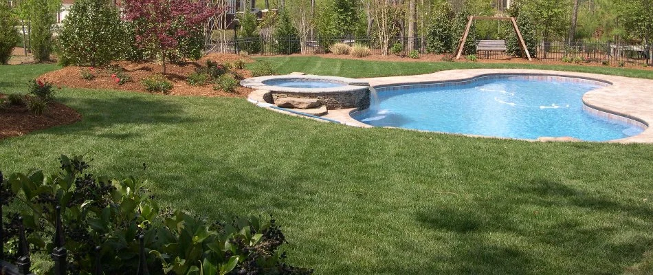 Lawn and pool in the yard of a property in Will-O-Dean Acres, NC.