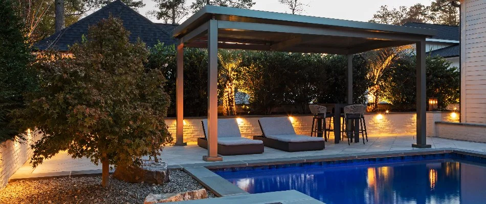 Cabana with lounge chairs by a pool in Cary, NC.