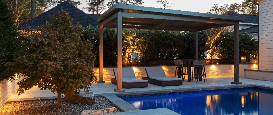 Cabana with chairs and small trees around a pool in Morrisville, NC.