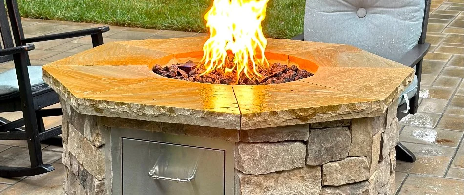 Circular fire pit on a lawn in Cary, NC.