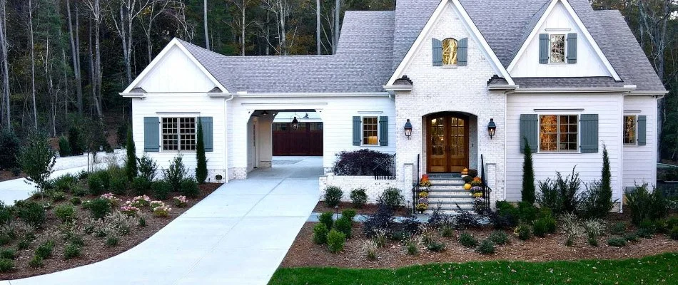 House in Fearrington, NC, with driveway and landscaping.