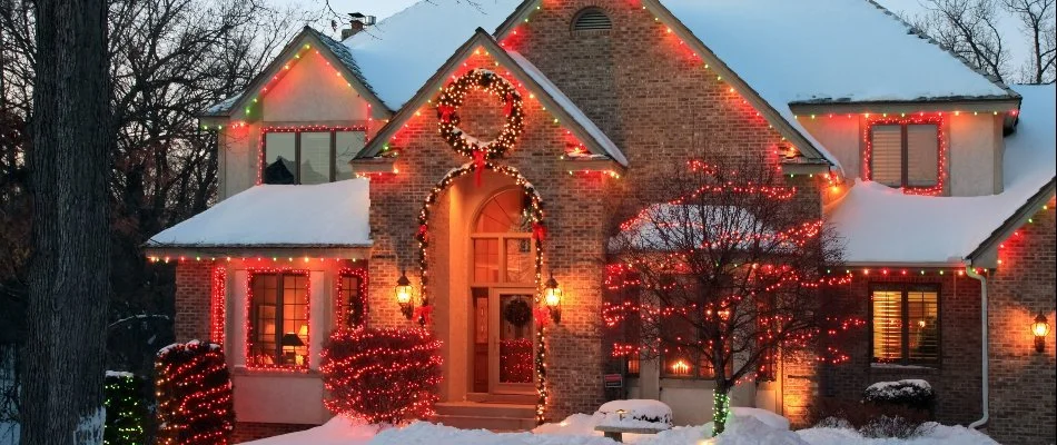 House in Cary, NC, with red and yellow holiday lights. 