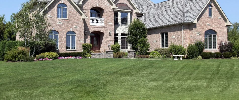 A large house in Cary, NC, with landscaping and mowed grass.