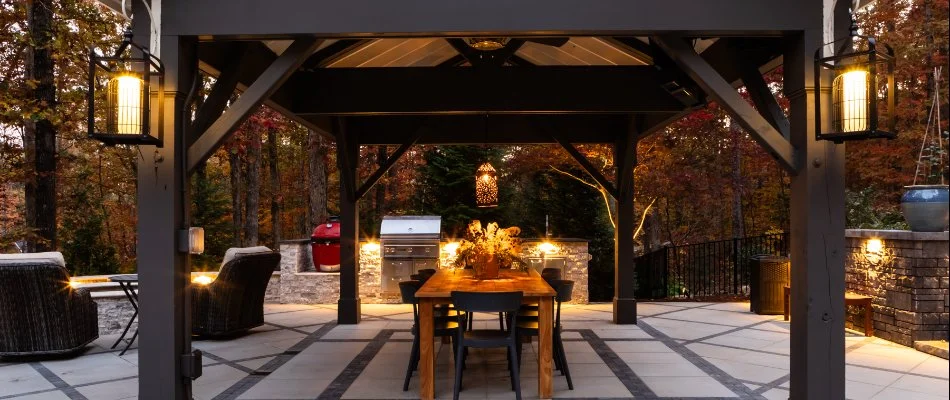 Outdoor living space with pavilion and outdoor kitchen on a property in Youngsville, NC.