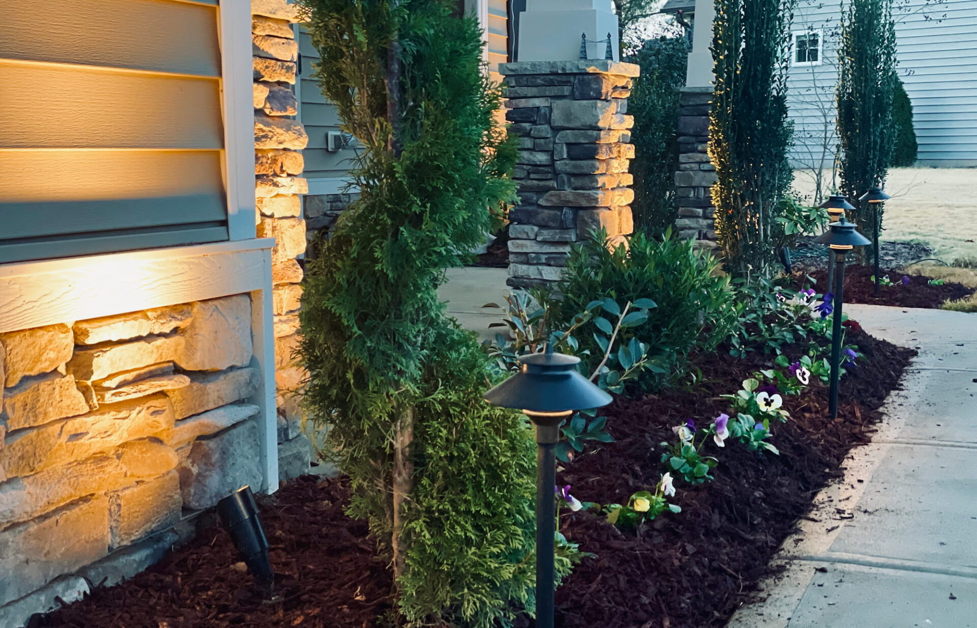 Exterior lights by the top landscape lighting company in Raleigh NC make a home safer while lighting its best features.