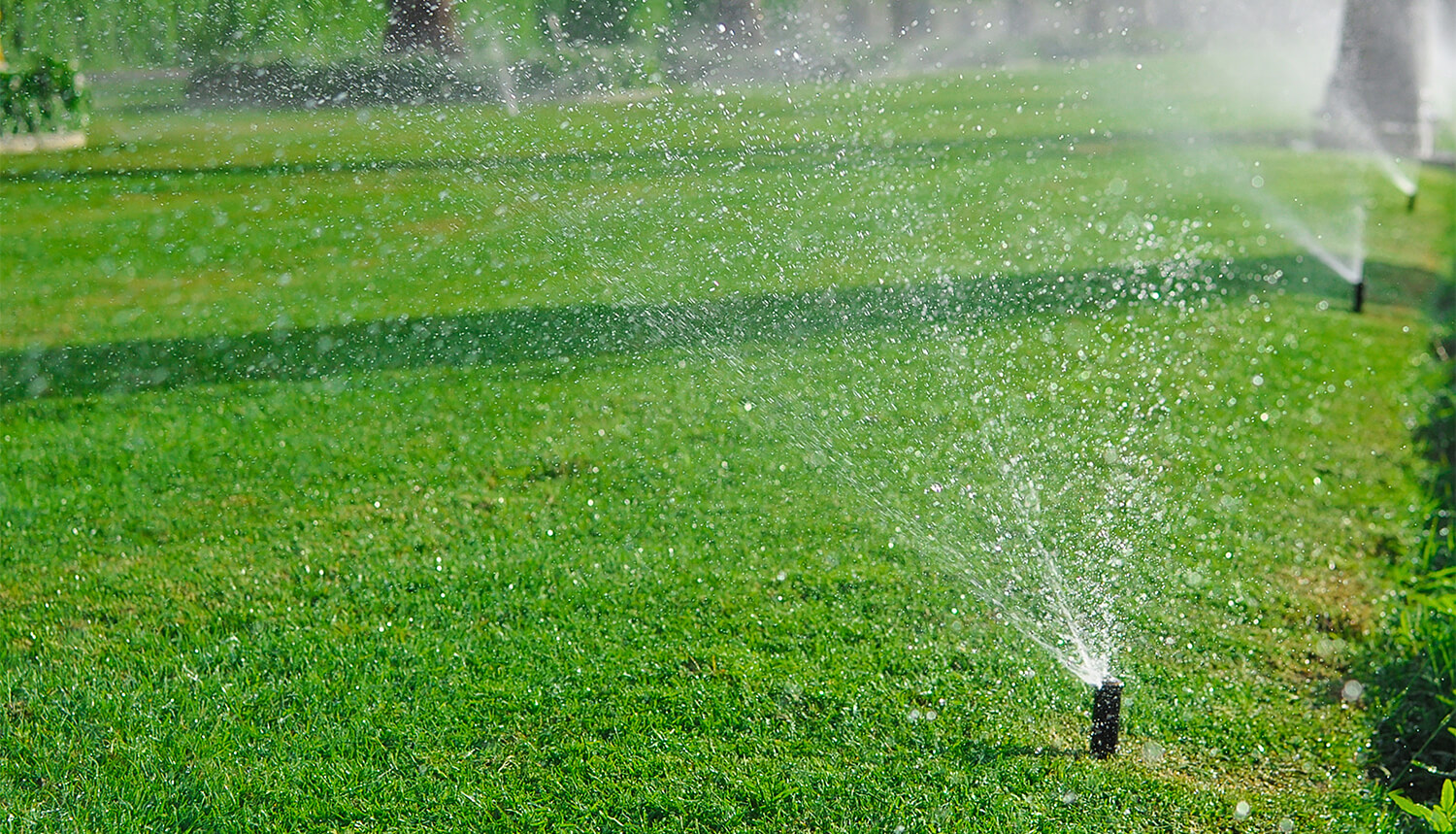 Sprinkler system spraying a lawn